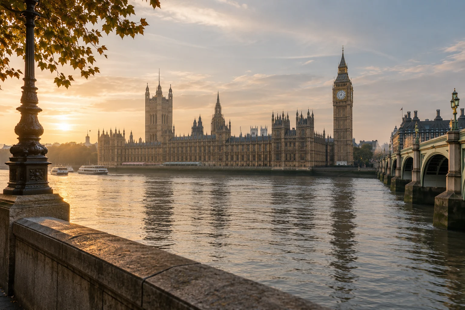 The Palace of Westminster and Elizabeth Tower across the River Thames in soft morning light.